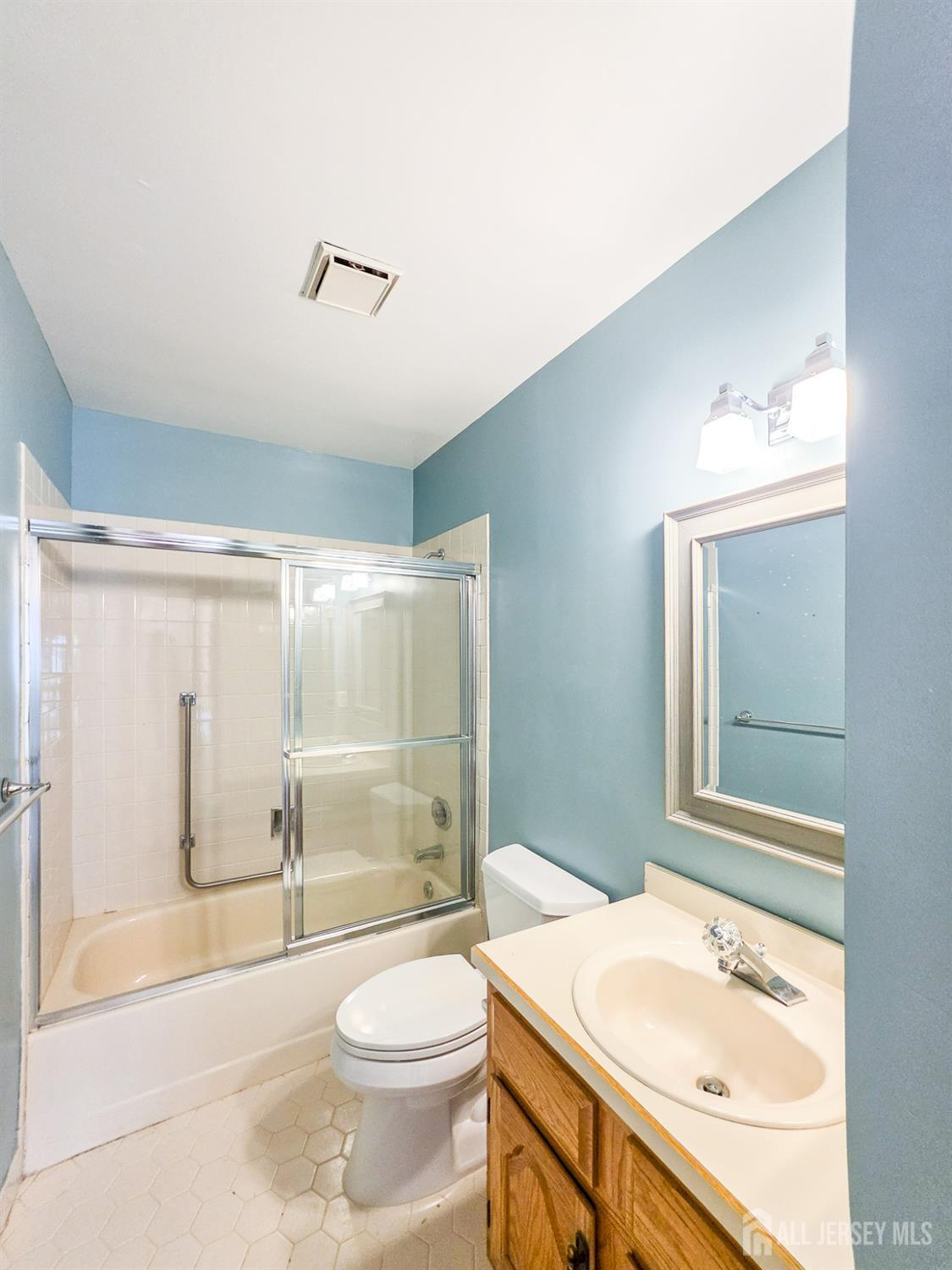 1 H Rutland Lane Monroe Township, NJ 08831 - Photo 10 of 26 a bathroom with a sink a toilet and shower