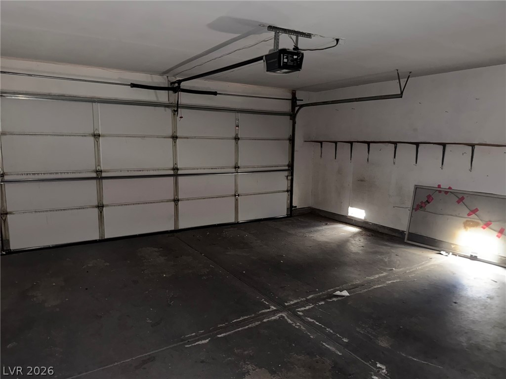 277 Gentle Bay Avenue Henderson, NV 89074 - Photo 10 of 43 This spacious garage offers ample room for parking and storage.