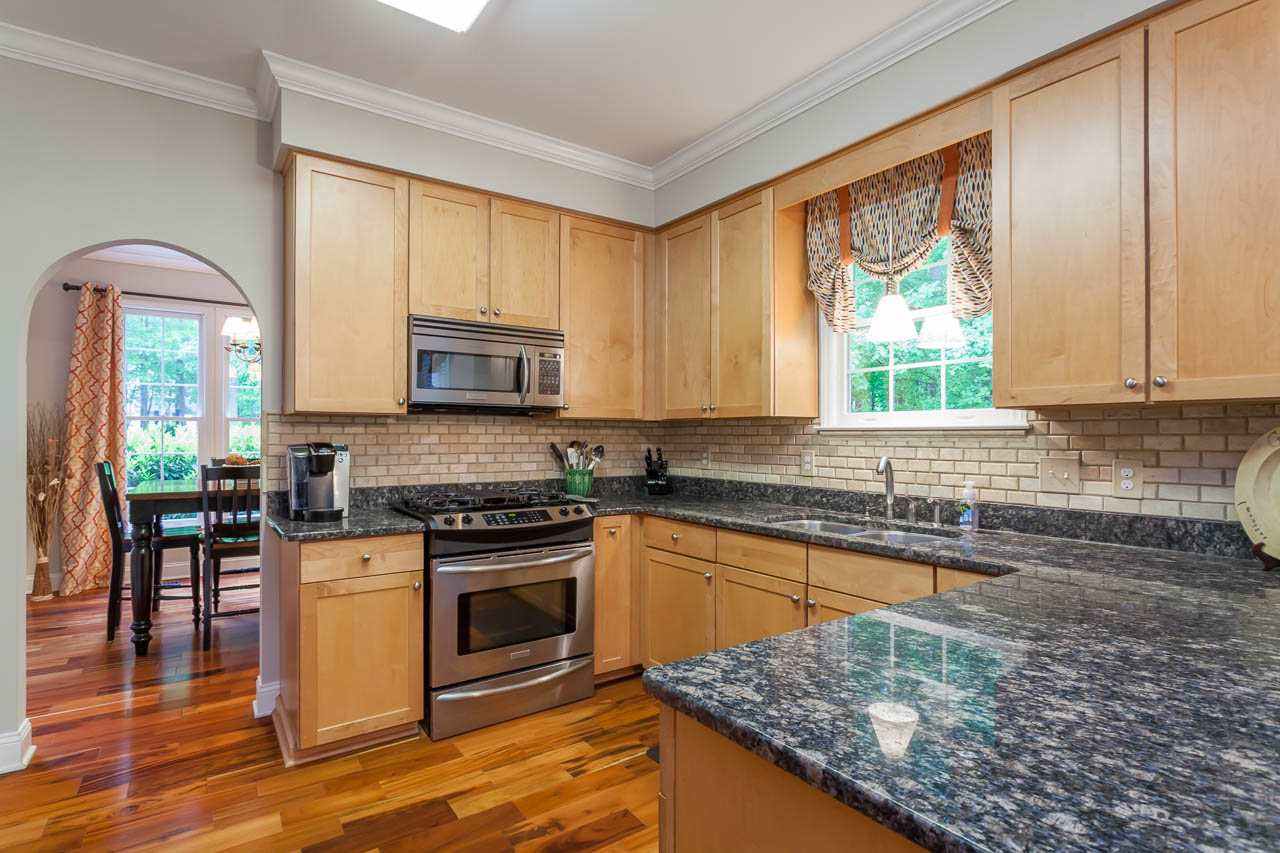 12208 Warwickshire Way Raleigh, NC 27613 - Photo 6 of 23 Custom Maple cabinets with tons of storage. Kitchen
