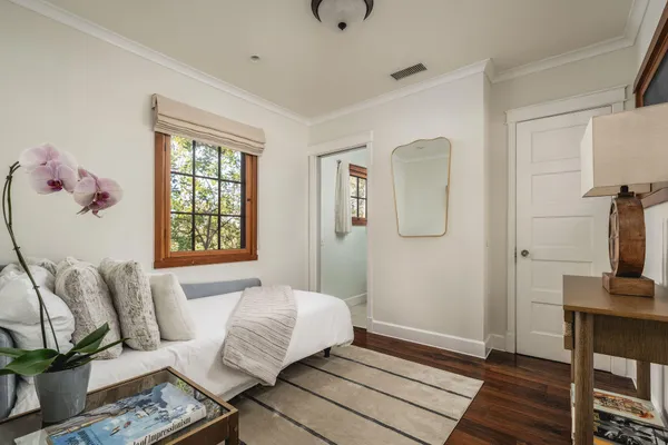 a bedroom with a bed and window