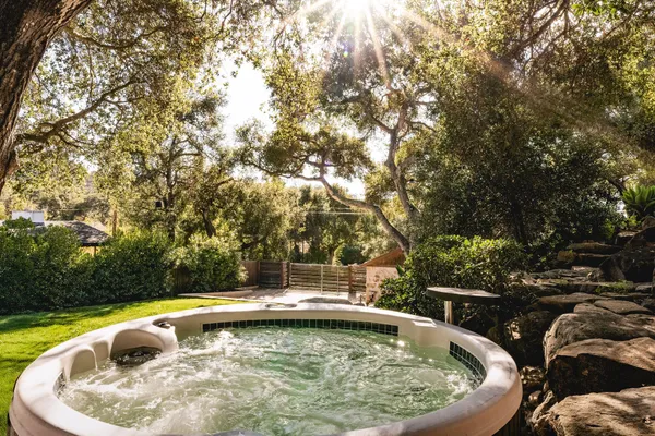 a view of a swimming pool with a yard