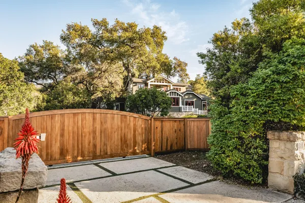 a view of a door with a wooden fence