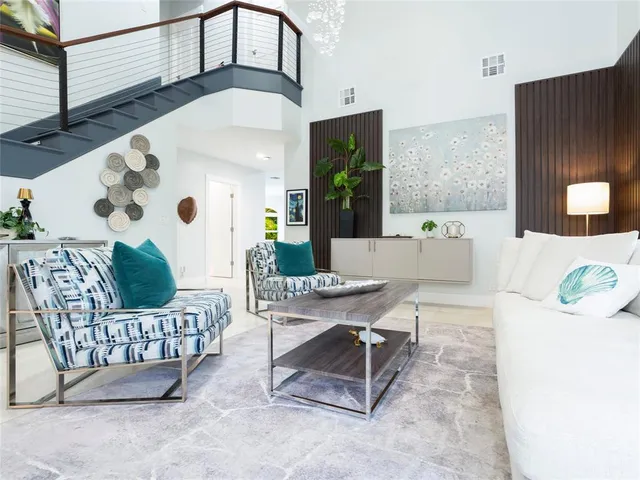 a kitchen that has a lot of cabinets a sink and a stove in it