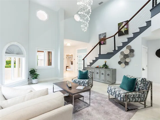 a kitchen with a dining table wooden cabinets stainless steel appliances and dining table