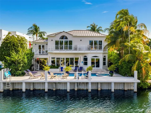 a view of a lake with a lounge chairs