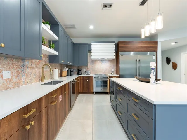 a bathroom with a toilet sink vanity and mirror