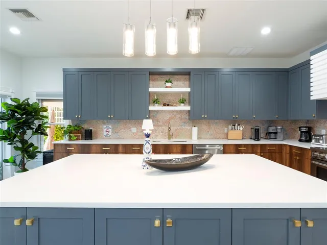 a white bed sitting in a bedroom next to a window