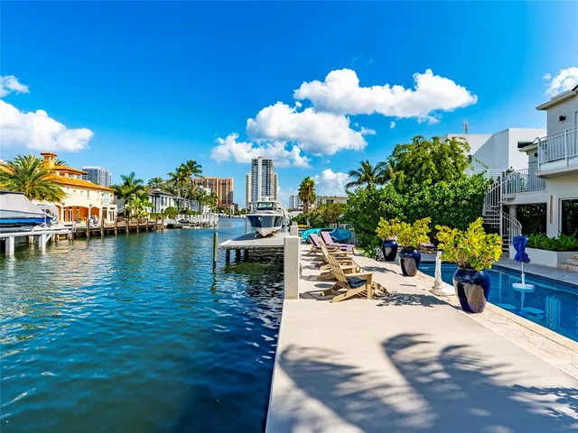 a view of a swimming pool with an outdoor seating
