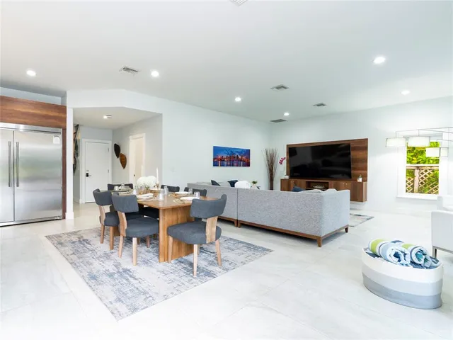 a living room with fireplace furniture and a flat screen tv