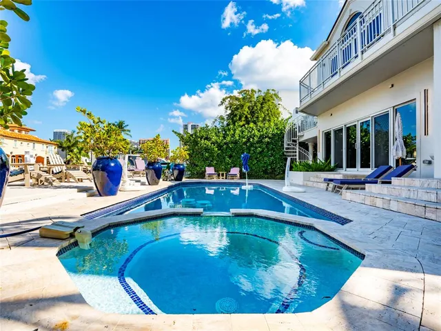 an aerial view of a house with a lake view
