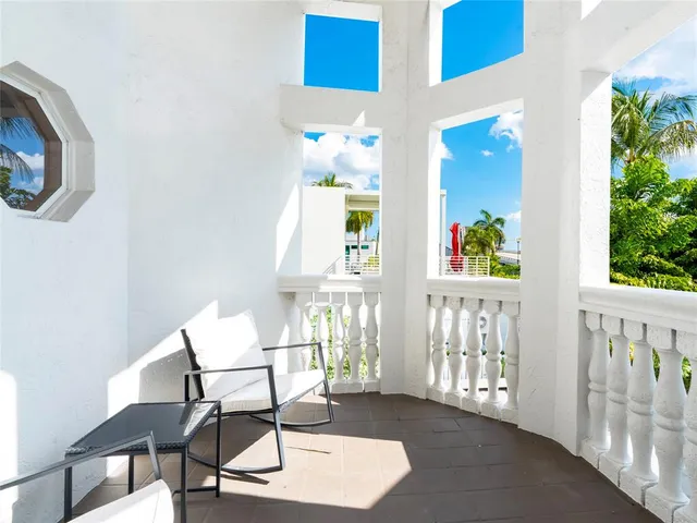 a bathroom with a shower a toilet and a sink