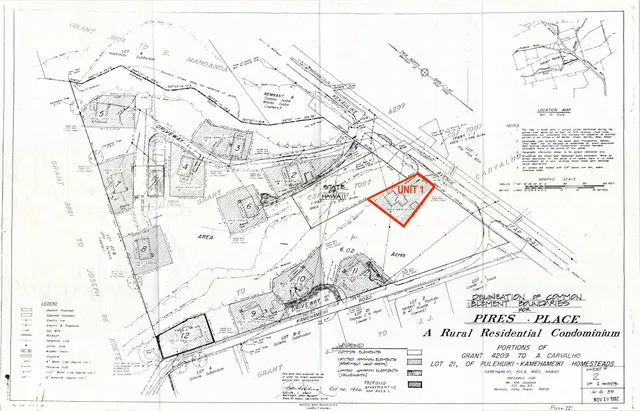 an aerial view of a house with garden space and sitting area