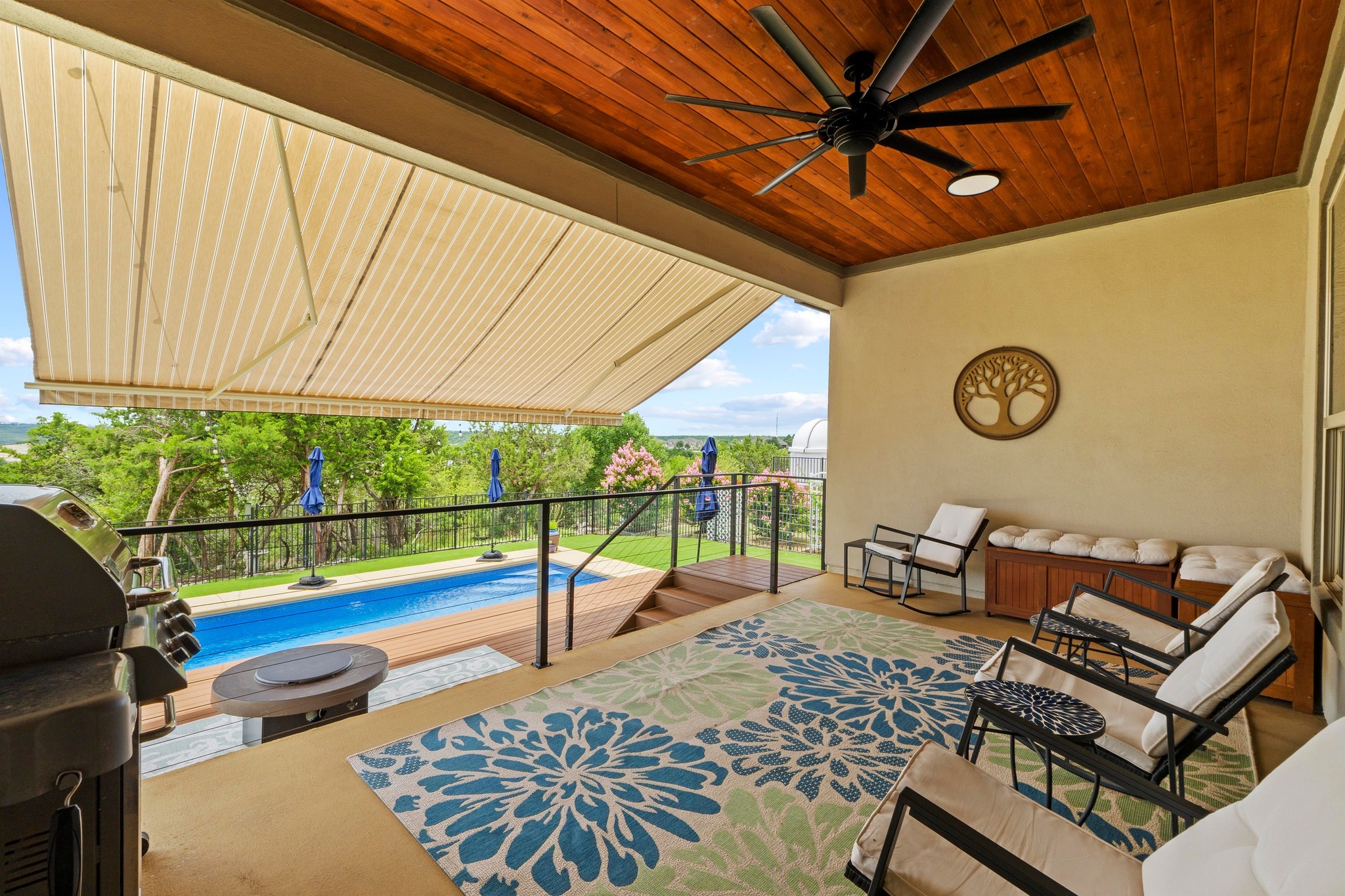 1329 Siena Sunset Road Leander, TX 78641 - Photo 27 of 33 Oversized covered patio shown with extended retractable awning to keep the sun at bay.