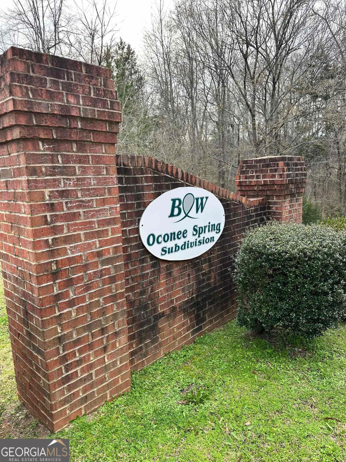 a view of a brick wall with a pot