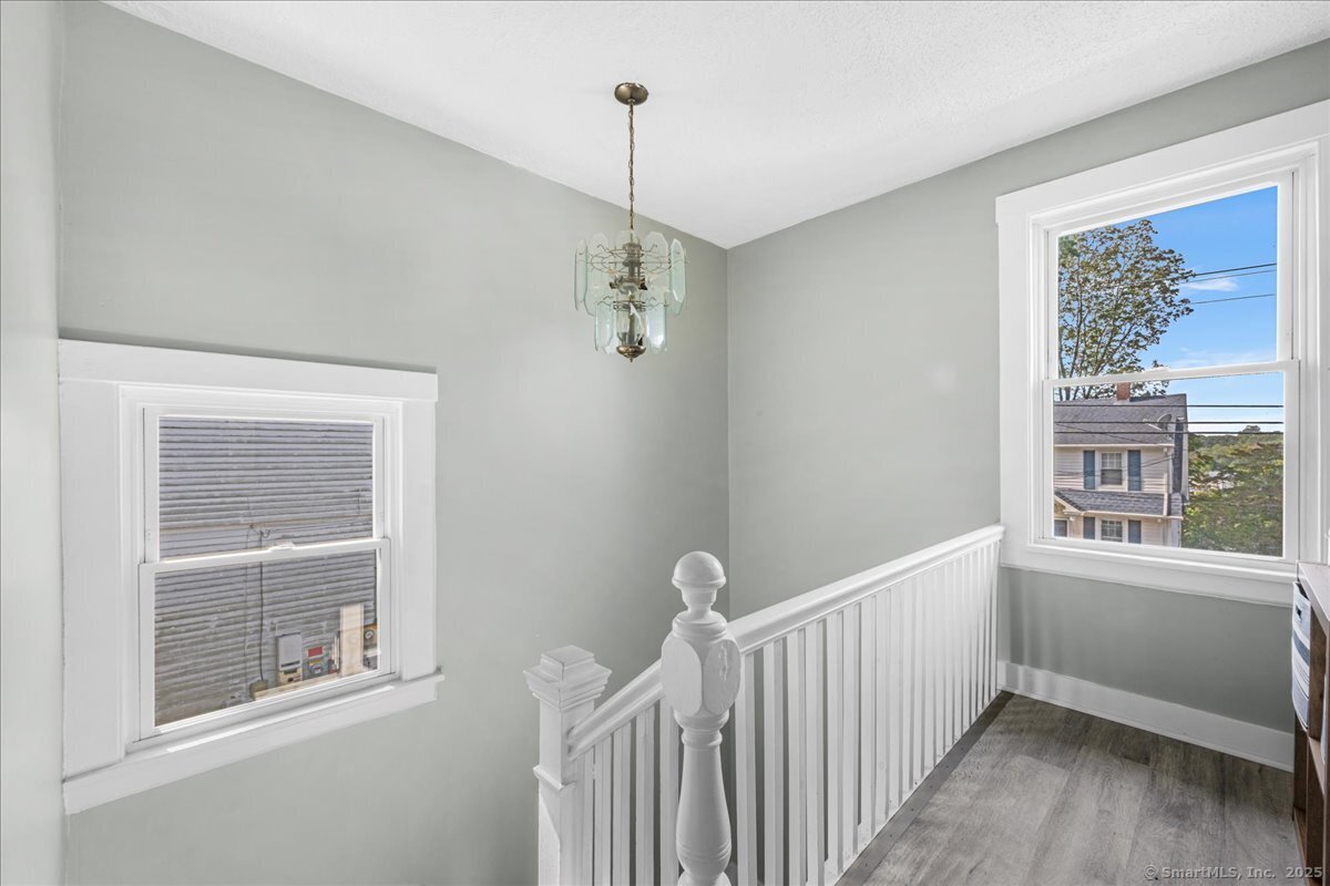 55 Raymond Street New London, CT 06320 - Photo 23 of 31 a view of a room with window wooden floor and front door