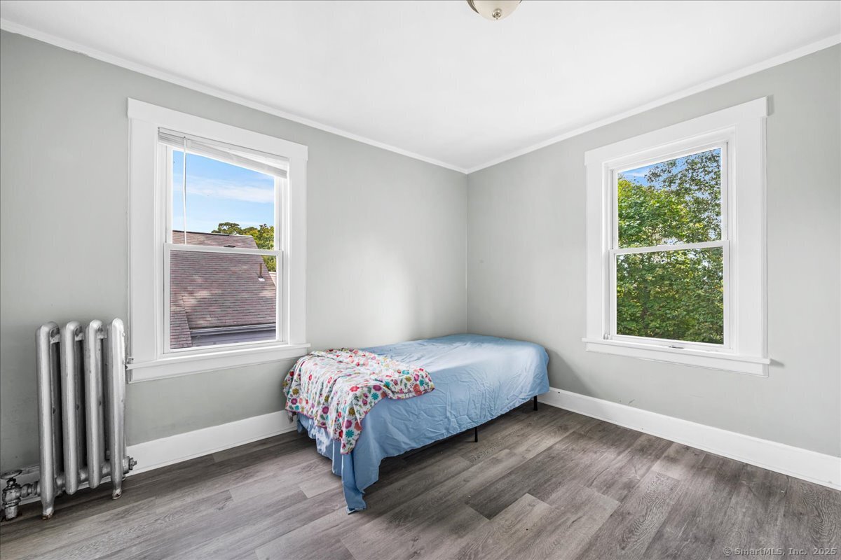 55 Raymond Street New London, CT 06320 - Photo 24 of 31 a bedroom with a bed and a window