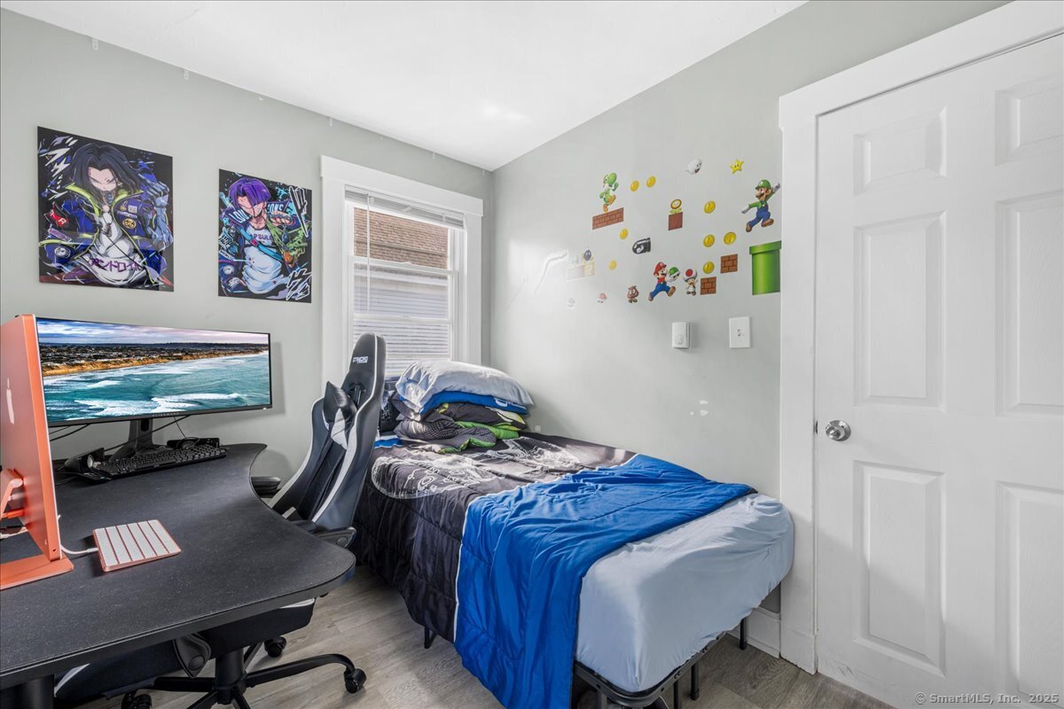 55 Raymond Street New London, CT 06320 - Photo 29 of 31 a bedroom with a bed and furniture