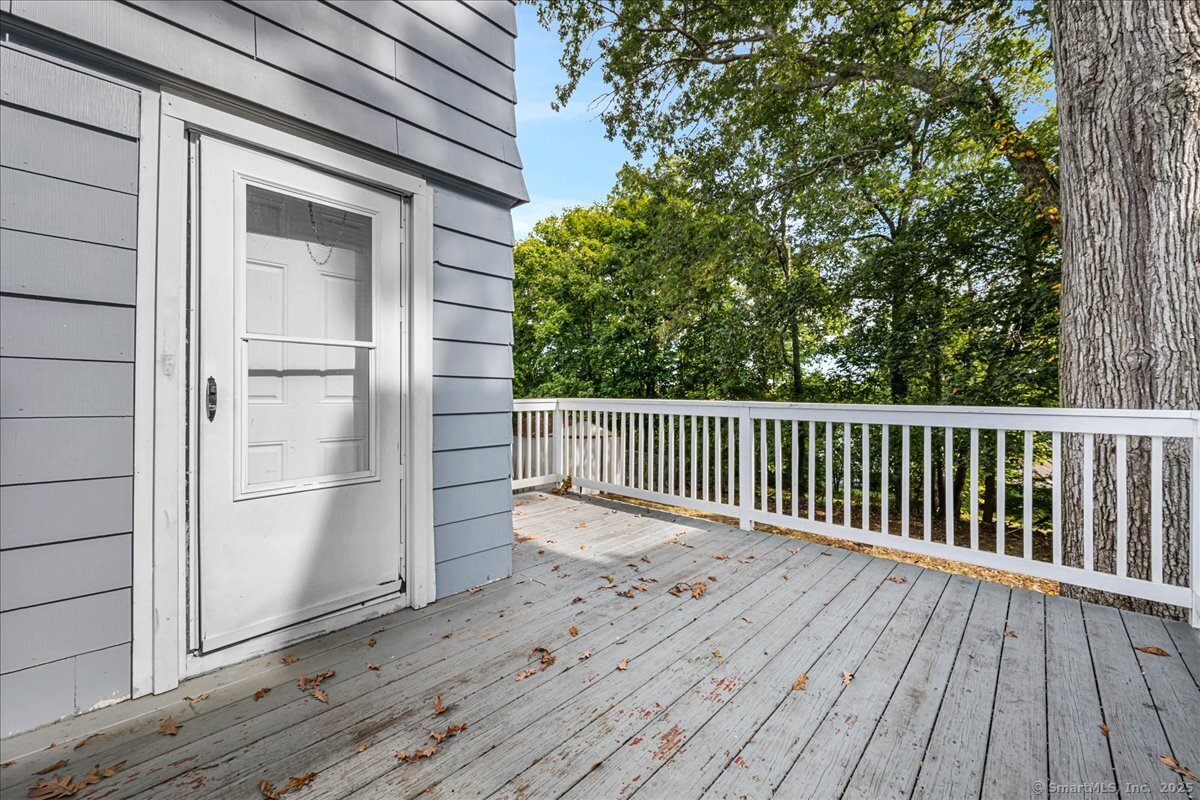 55 Raymond Street New London, CT 06320 - Photo 30 of 31 a view of a wooden deck besides a house