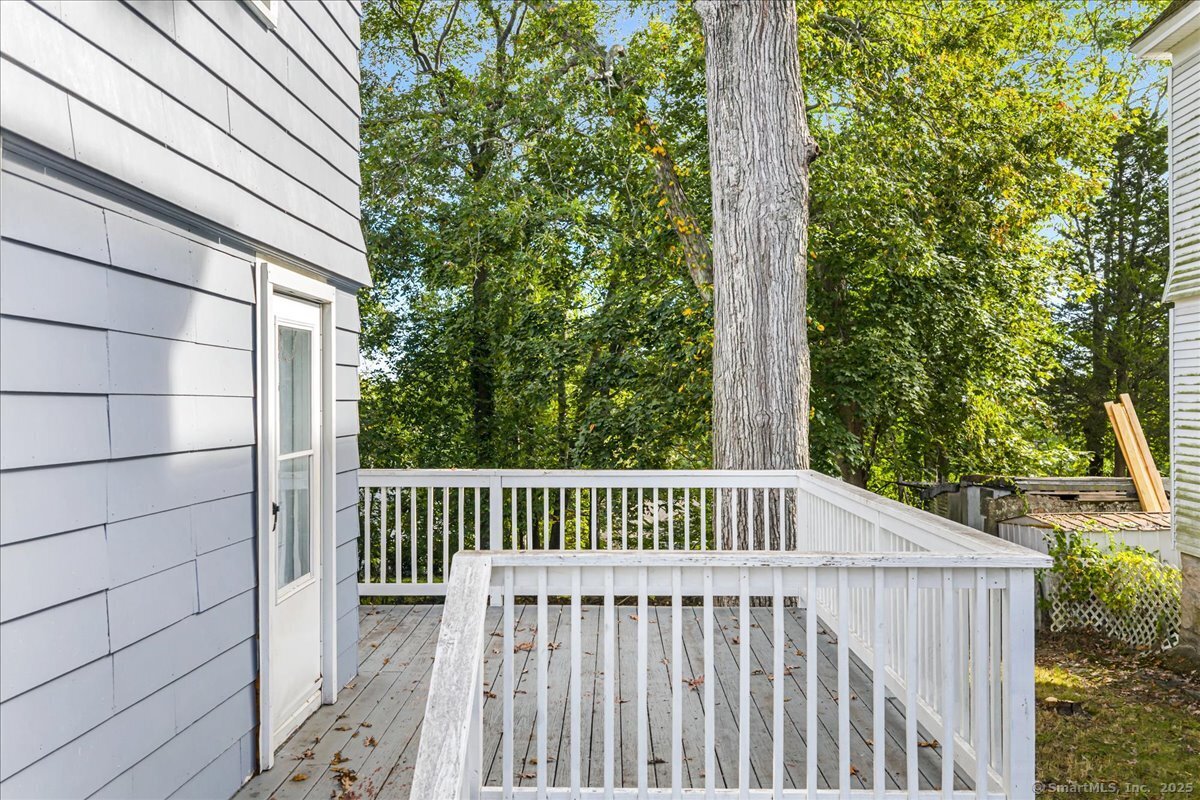 55 Raymond Street New London, CT 06320 - Photo 4 of 31 a view of backyard with deck and trees