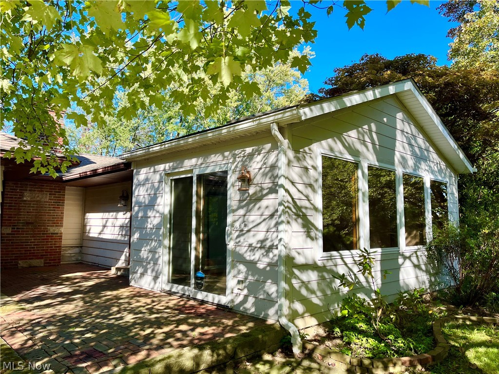 2979 Shade Road Akron, OH 44333 - Photo 3 of 29 Front 4-seasons room, great for plants and sunshine facing South!
