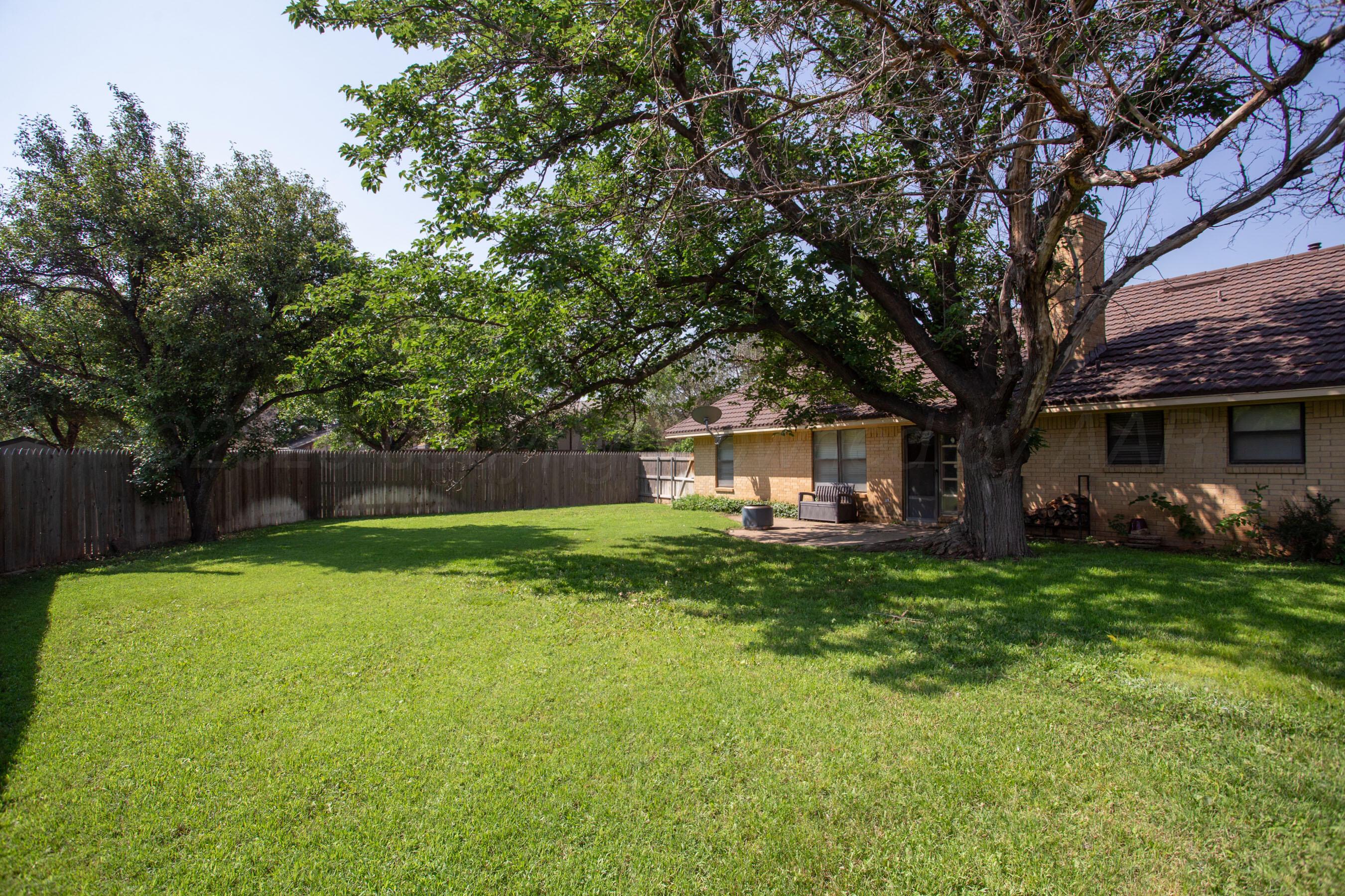 3729 Wayne Street Amarillo, TX 79109 - Photo 30 of 30 a front view of a house with a garden and trees
