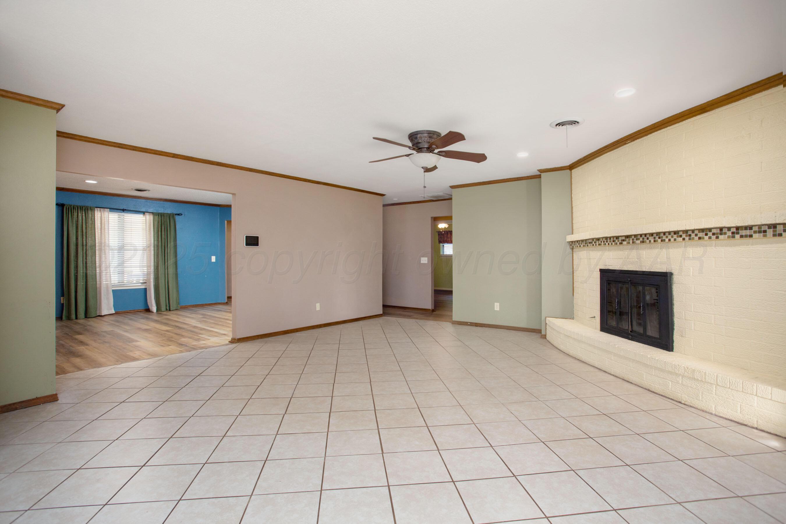 3729 Wayne Street Amarillo, TX 79109 - Photo 10 of 30 a view of an empty room with a fireplace