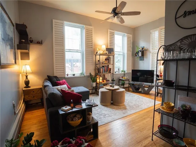 a living room with furniture and a window