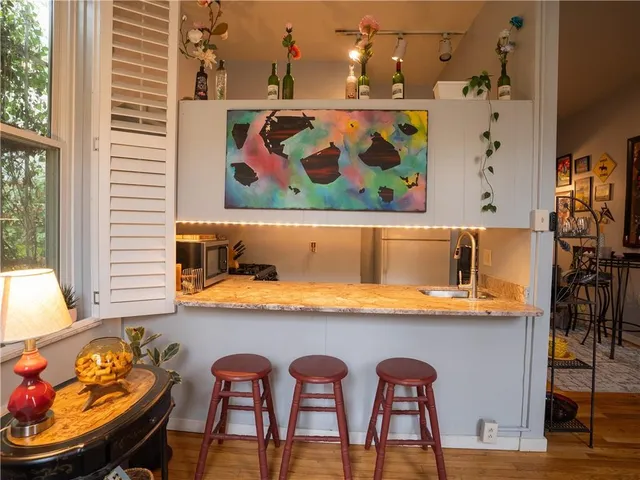 a view of a dining room with furniture and window