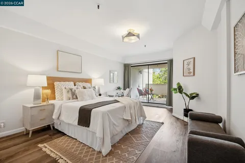 a bedroom with a bed and a couch