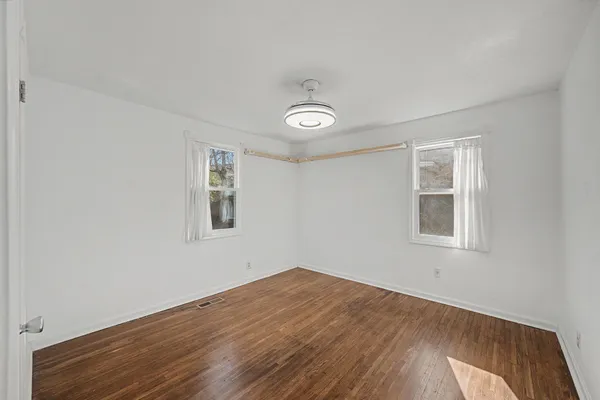 a bathroom with a shower a toilet and a sink