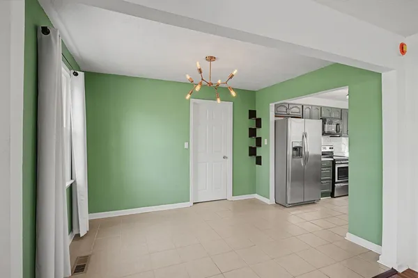 a view of a kitchen with a sink and a kitchen counter top space