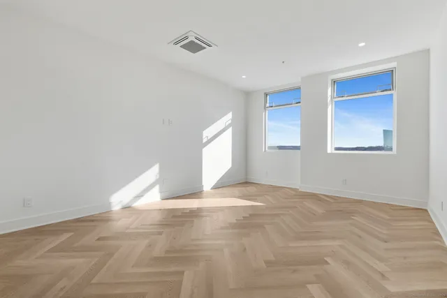 a view of an empty room with a window
