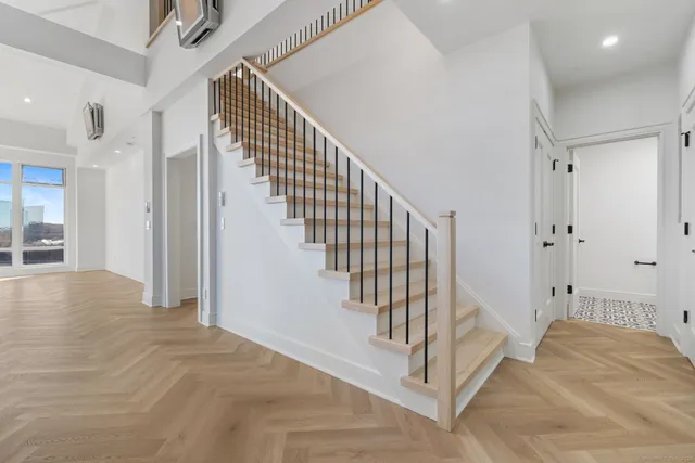 a view of a hallway with a bedroom and entryway