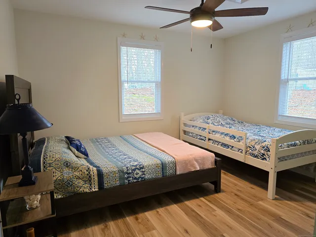 a bedroom with bed and window