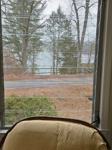 a view of a glass door and a yard