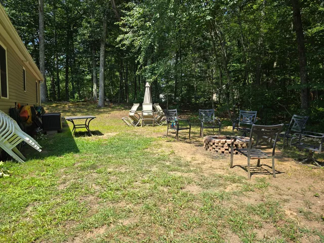 a view of swimming pool with a patio