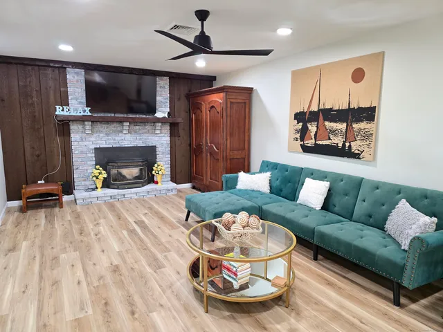 a living room with furniture and a fireplace