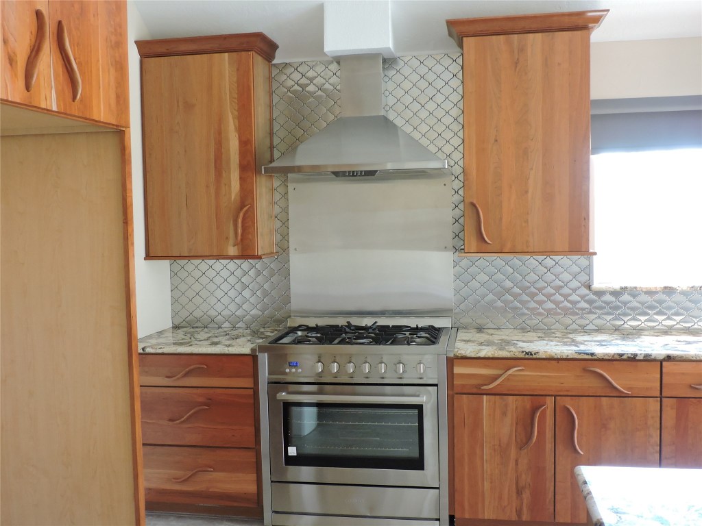 25730 Beckendorff Road Katy, TX 77493 - Photo 15 of 42 a stove top oven sitting inside of a kitchen