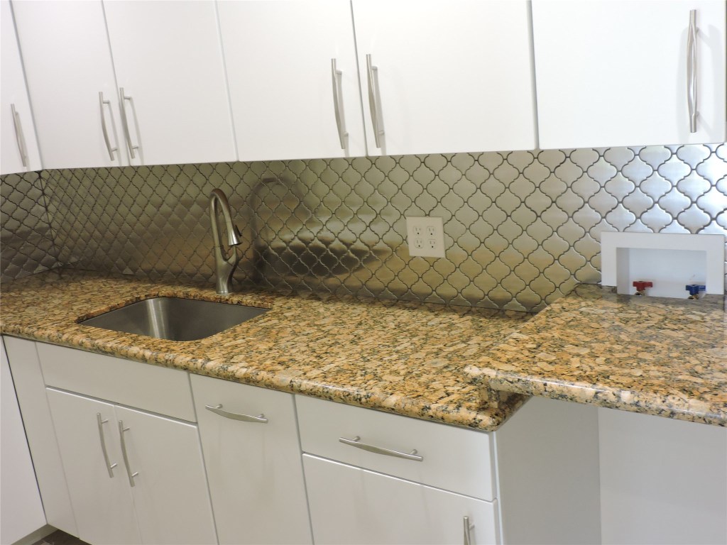 25730 Beckendorff Road Katy, TX 77493 - Photo 19 of 42 a kitchen with a sink and cabinets