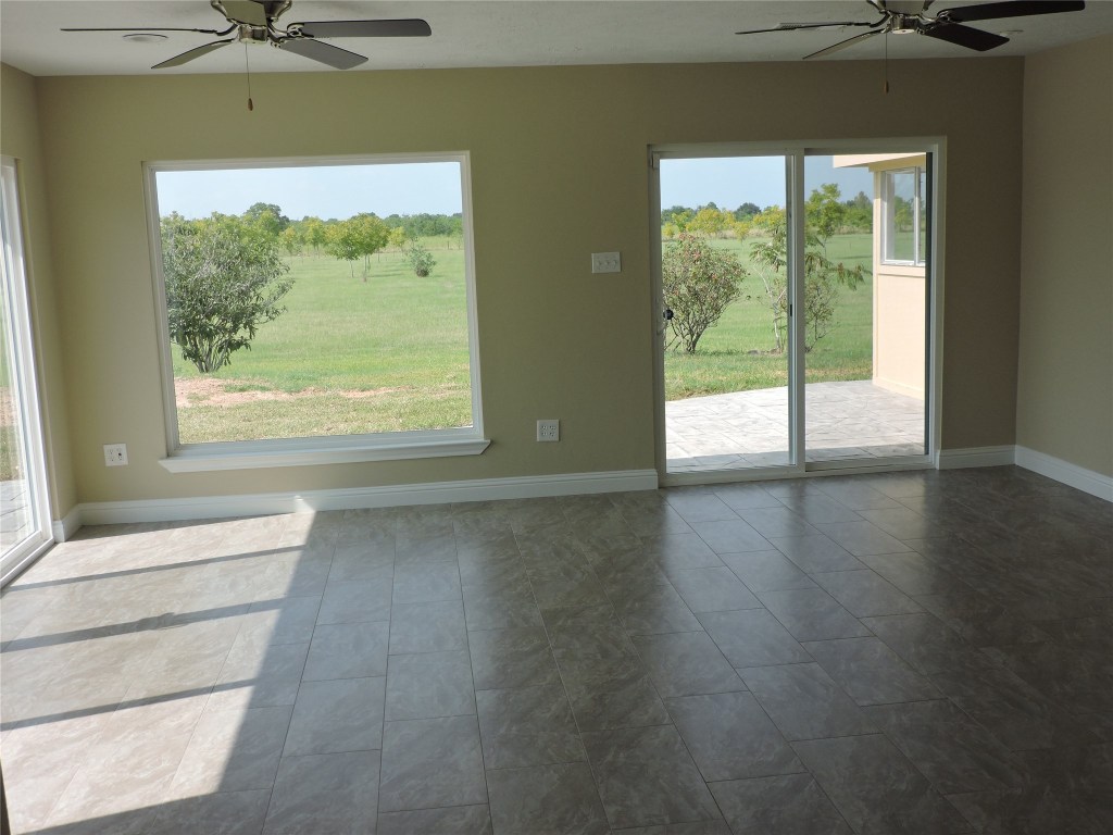 25730 Beckendorff Road Katy, TX 77493 - Photo 25 of 42 a view of a room with a window and a ceiling fan
