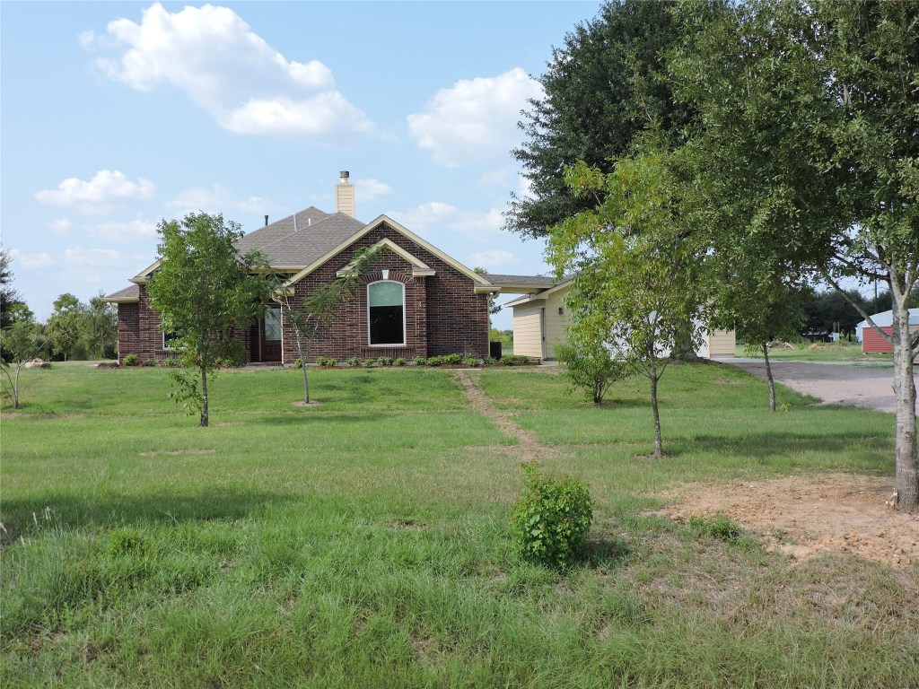 25730 Beckendorff Road Katy, TX 77493 - Photo 3 of 42 a view of a house with a backyard
