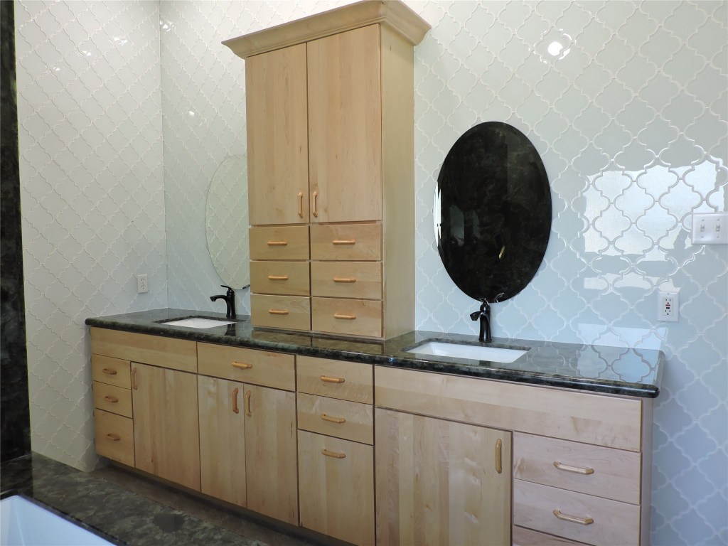 25730 Beckendorff Road Katy, TX 77493 - Photo 31 of 42 a bathroom with a granite countertop sink and a mirror
