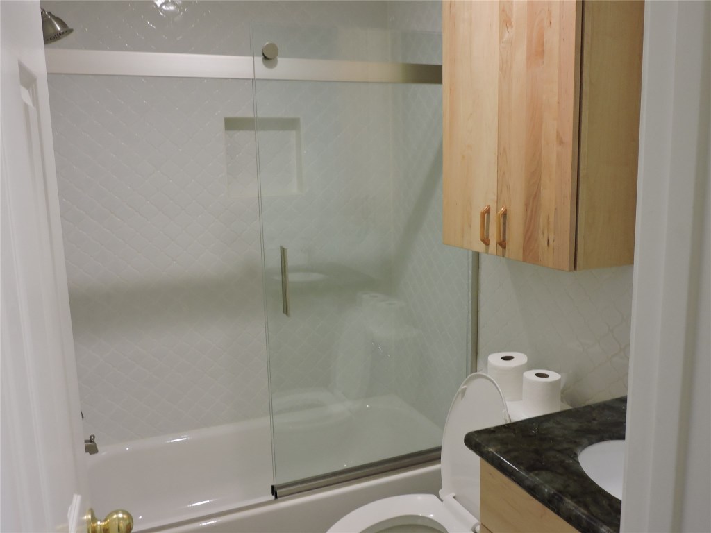 25730 Beckendorff Road Katy, TX 77493 - Photo 35 of 42 a bathroom with a granite countertop bathtub shower and toilet