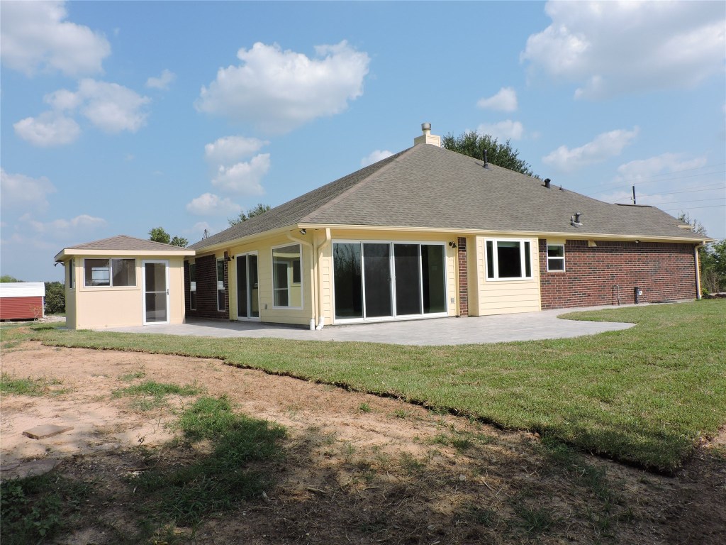25730 Beckendorff Road Katy, TX 77493 - Photo 8 of 42 a front view of a house with a garden