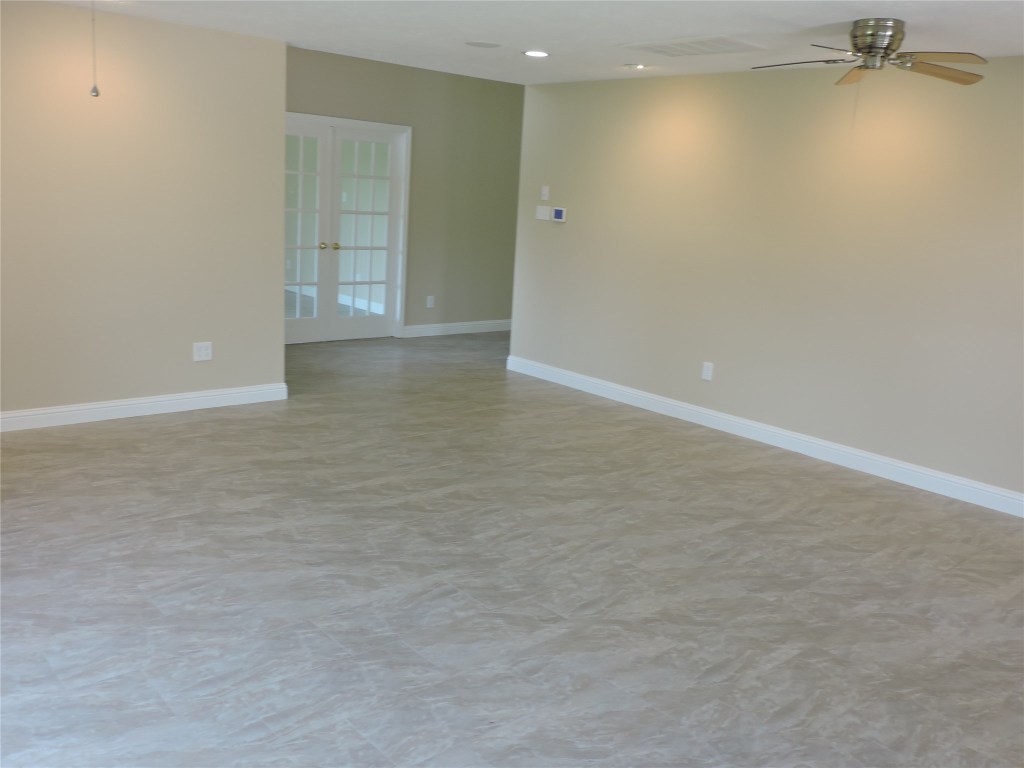 25730 Beckendorff Road Katy, TX 77493 - Photo 10 of 42 an empty room with a empty space and windows
