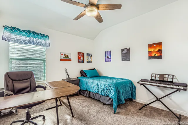 a bedroom with furniture and a window