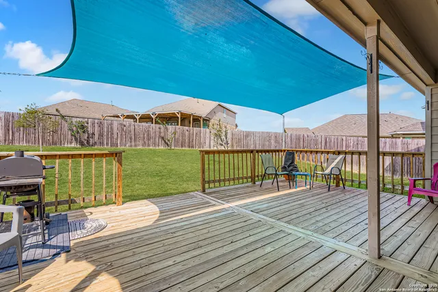 a view of a balcony with wooden floor