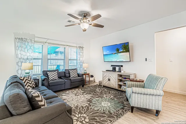 a living room with furniture or couch and a flat screen tv