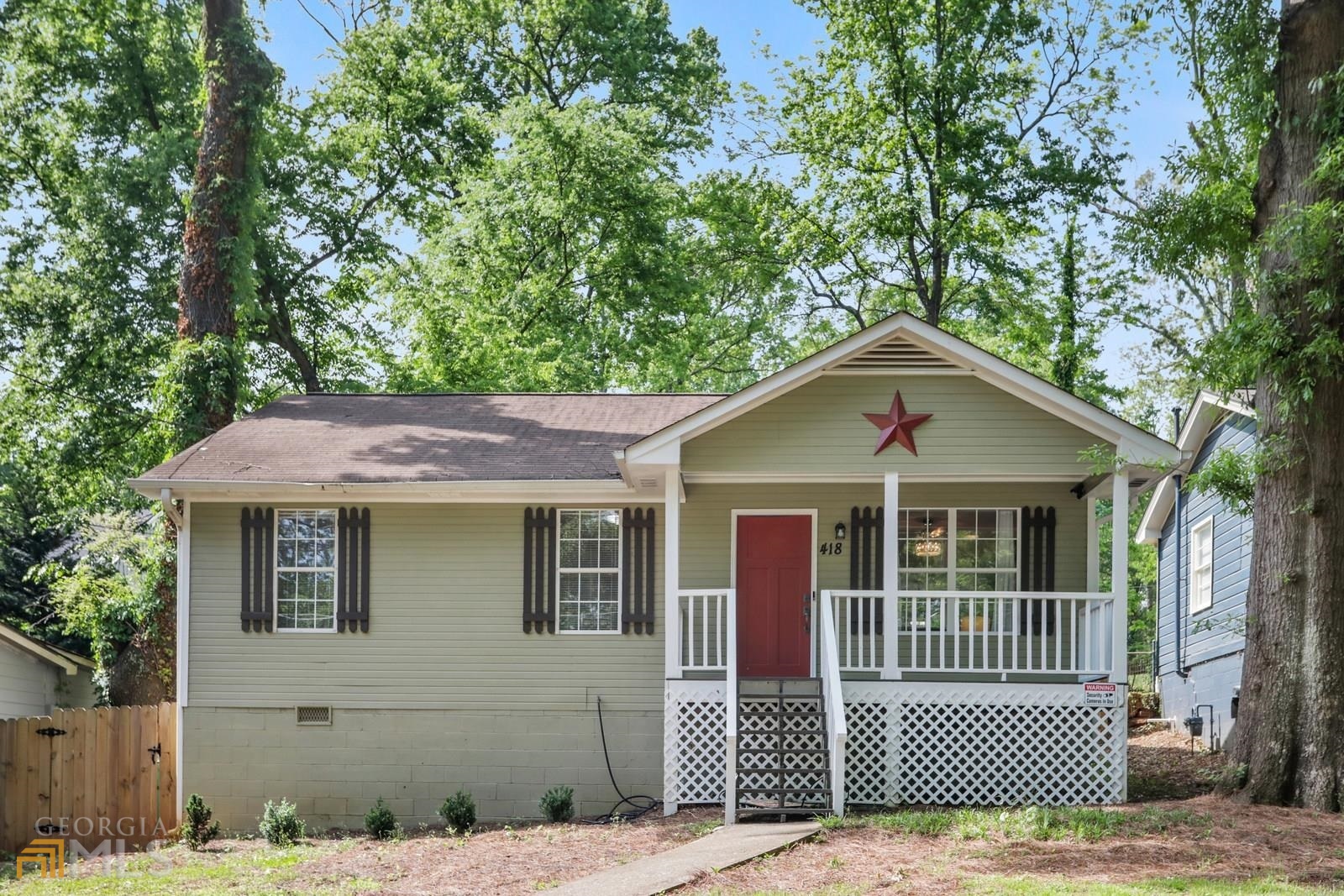 418 Dorsey Road Hapeville, GA 30354 - Photo 1 of 1 a front view of a house with a garage
