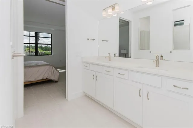 a bathroom with a sink and mirror